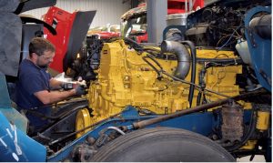Image of a service technician performing maintenance on a truck at Rig360 Truck Centers, ensuring top-notch service and reliability for your fleet.