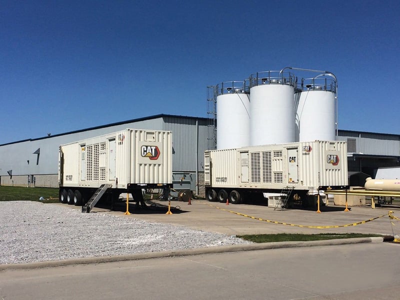 Large Mobile Power Generators Outside a Facility