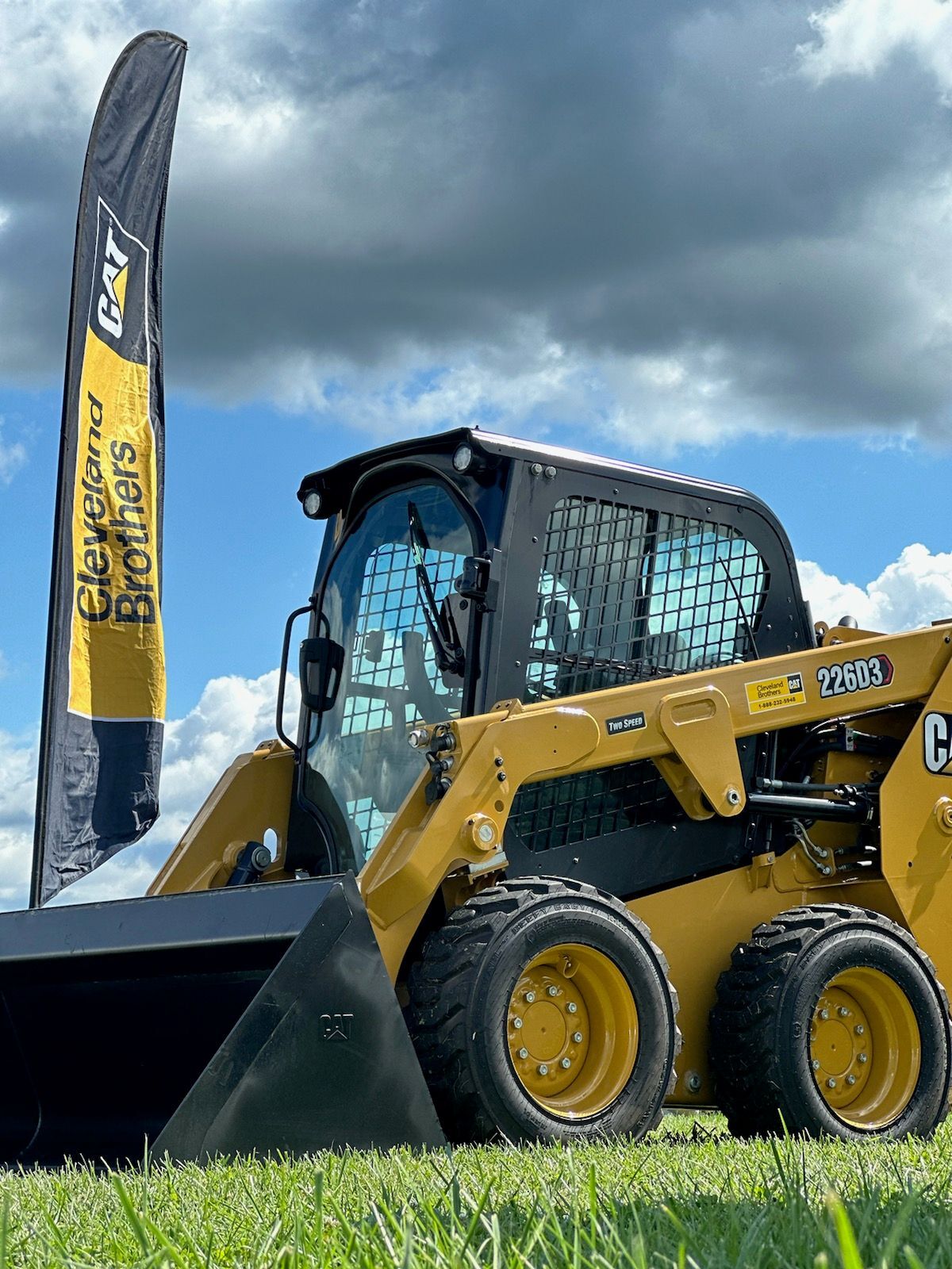 Operator walking through a Cat compact machine